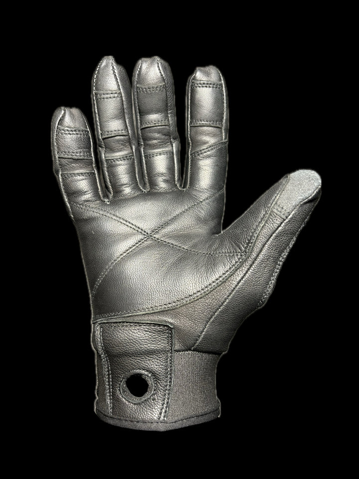 Palm side of black utility glove on a black background